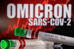 FILE PHOTO: Test tubes labelled "COVID-19 Test Positive" are seen in front of displayed words "OMICRON SARS-COV-2" in this illustration taken December 11, 2021. REUTERS/Dado Ruvic/Illustration